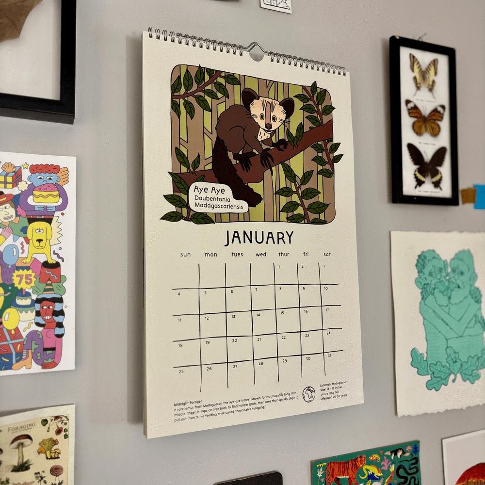 Calendar with a January layout on a wall surrounded by other decorative items.