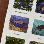 sticker sheet with illustrations of a goblin shark, platypus, and other animals on a white background.