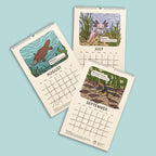 Three pages of a calendar showing illustrations of animals for August, July, and September on a light blue background.